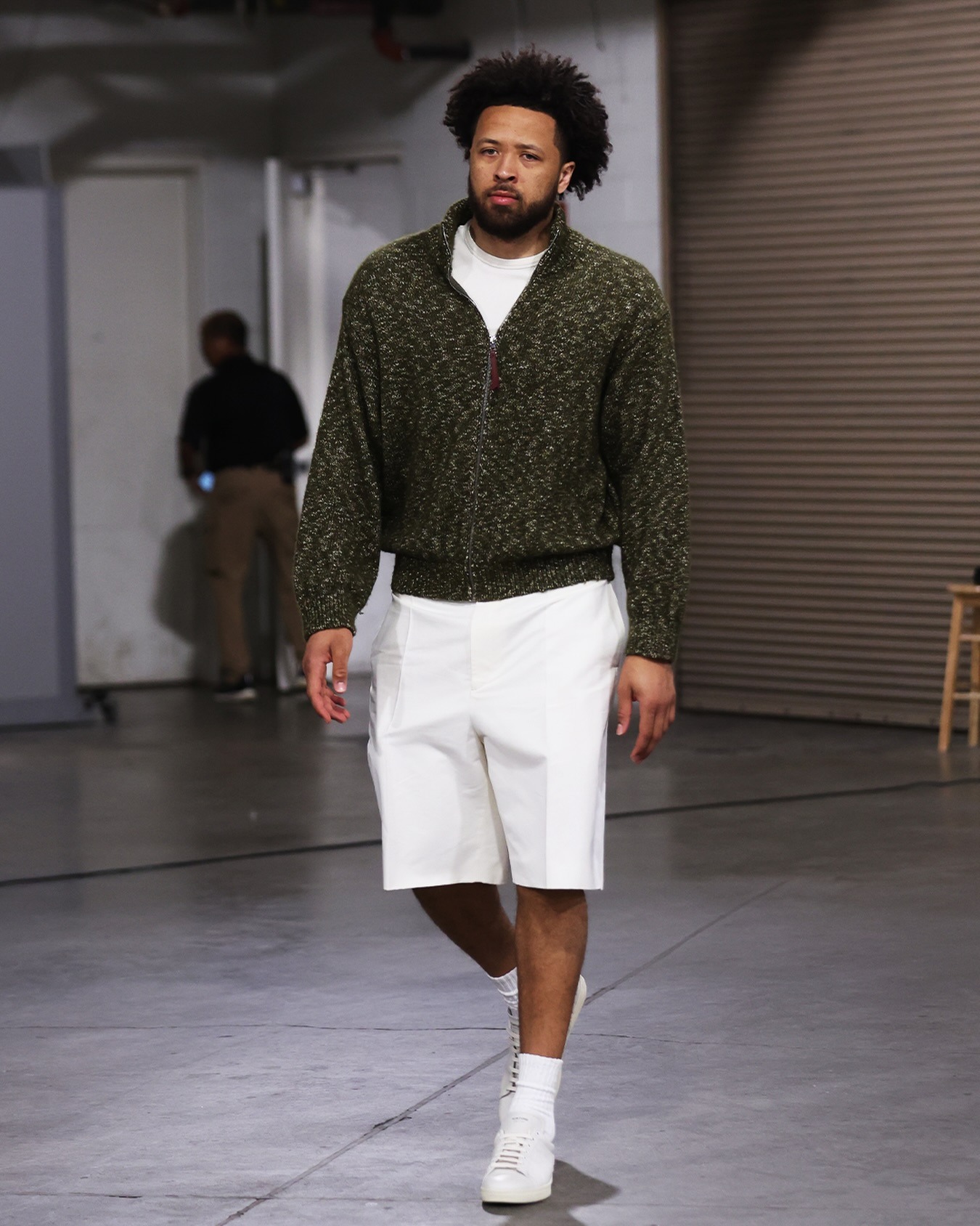 Cade Cunningham wearing Loewe Zip-up cardigan in cotton, linen and wool, Emporio Armani Emporio Armani straight-leg shorts and adidas Y-3 STAN SMITH Shoes.