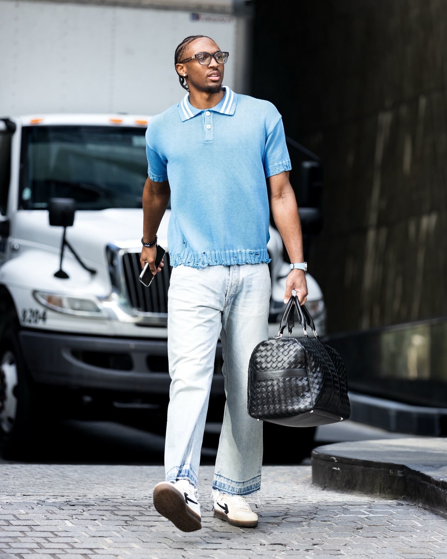 Jalen Williams wearing Marni Frayed-hem Polo Shirt, Off-White Off-White X Virgil Abloh End of Play lace-up sneakers and Bottega Veneta Duffle bag in.