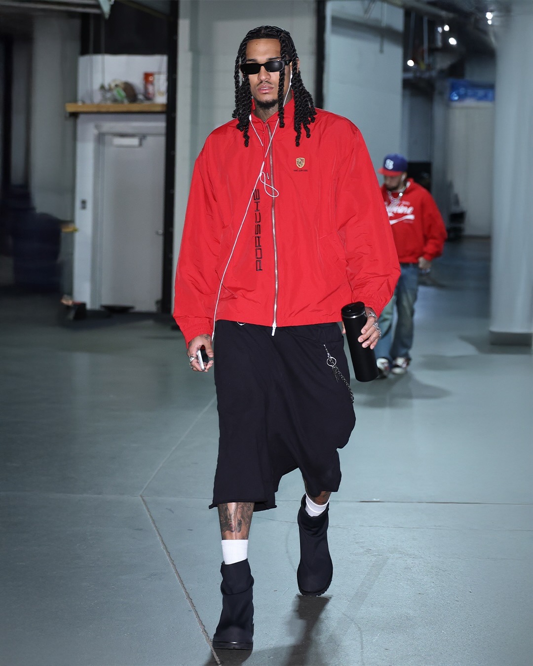 Jordan Clarkson wearing Aime Leon Dore Aime Leon Dore x Porsche Nylon Track Jacket Red and 424 MARATHON BOOT.
