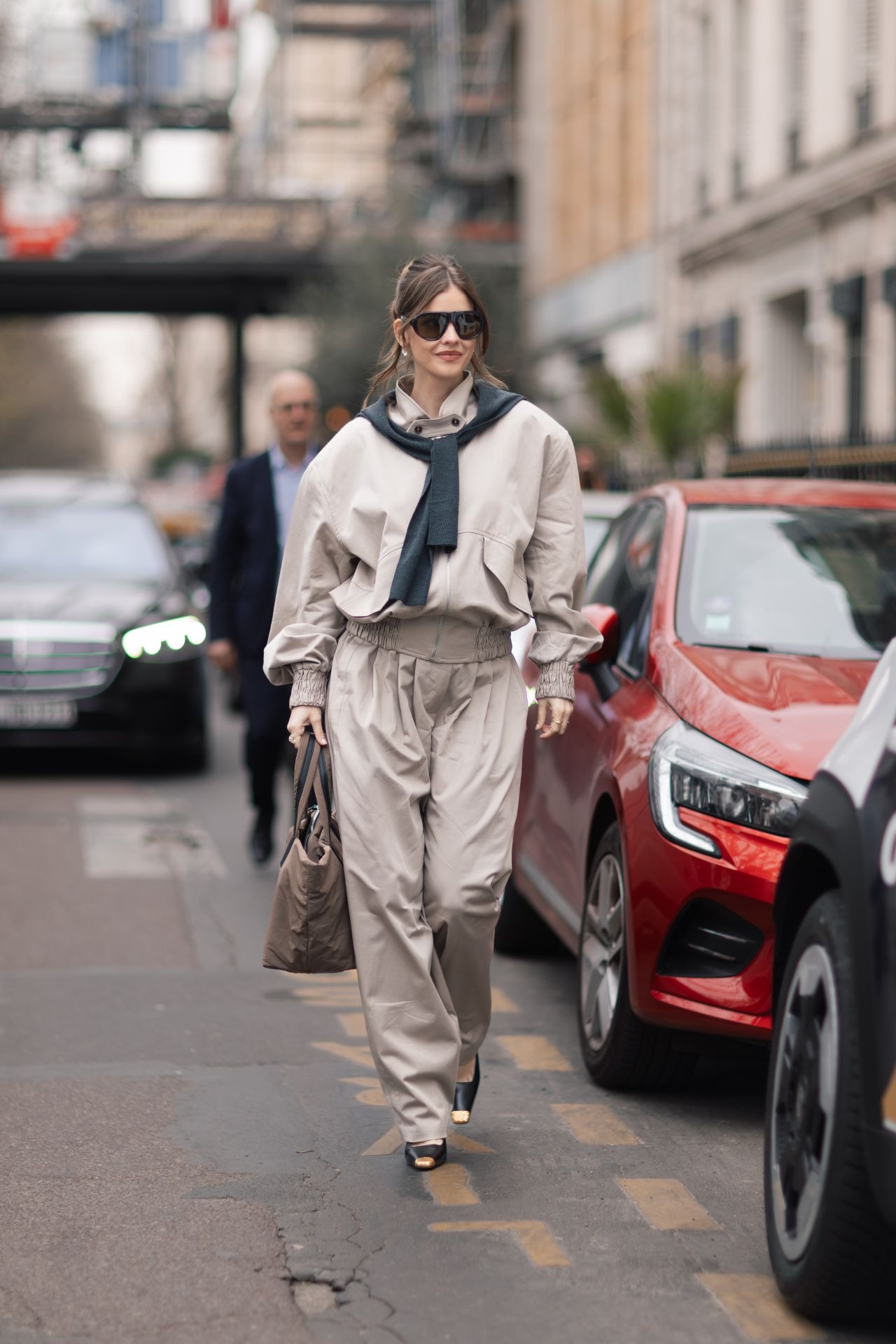 Barbara Palvin wearing Magda Butrym Beige Oversized Highneck Crop Bomber, Magda Butrym Belted cotton-blend tapered pants and Yves Saint Laurent JEANNE.