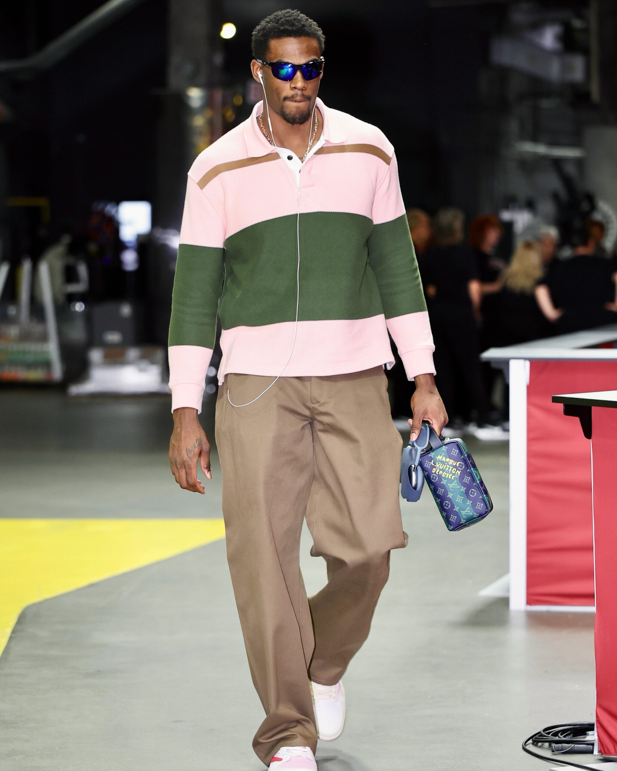 Jalen Duren wearing BOTTEGA VENETA T-shirt men Bottega Veneta, Acne Studios Twill trousers and Nike Travis Scott x Air Jordan 1 Retro Low OG ‘Sail.