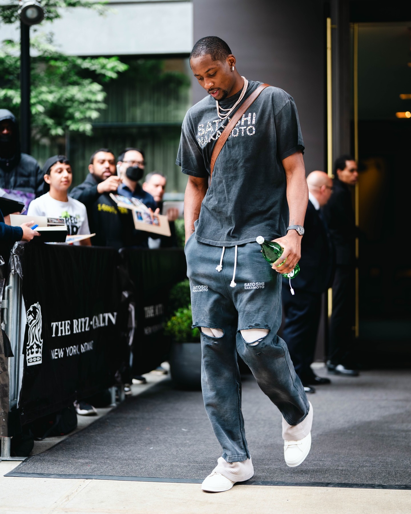 Jonathan Kuminga wearing Satoshi Nakamoto SHADOW LOGO TEE BLACK, SVRN Holy Ghost Layered Sweatpant in Washed Black and Lindiwe The Springbok Mini-Postman.