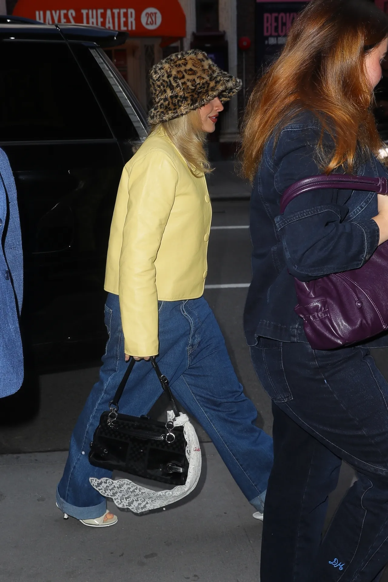 Sabrina Carpenter wearing Apparis Amara Leopard Pluche, Faux Fur Bucket Hat, My Mum Made It Buttoned Leather Jacket – Marigold and Jimmy Choo Skye 70.