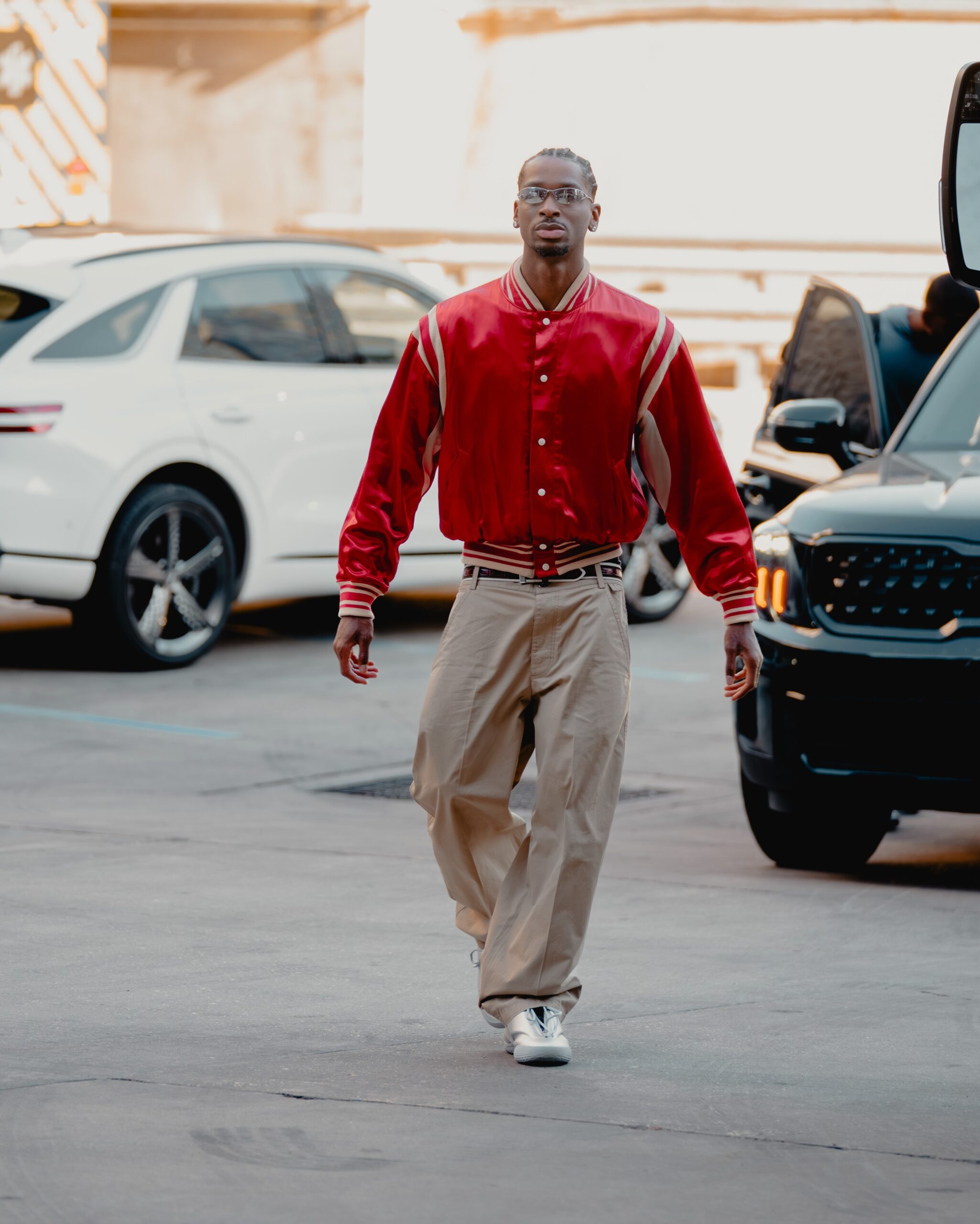 Shai Gilgeous Alexander wearing Ralph Lauren Polo Ralph Lauren Varsity Bomber Jacket, Carhartt Calder Pant and Converse SHAI 001.