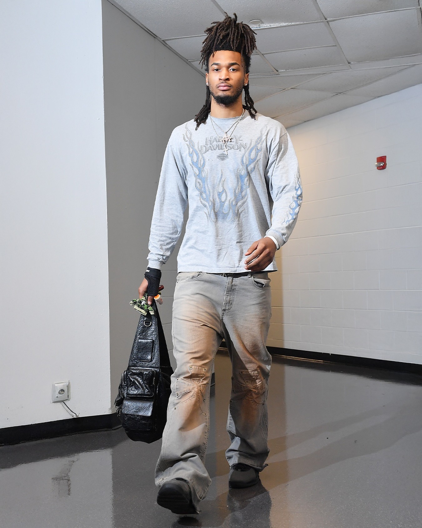 Stephon Castle wearing Balenciaga Men’s Superbusy Sling Bag Small in Black, Sekrit Chopper Carpenter Pant and Nike Air Jordan 10 Retro Shadow Mens.
