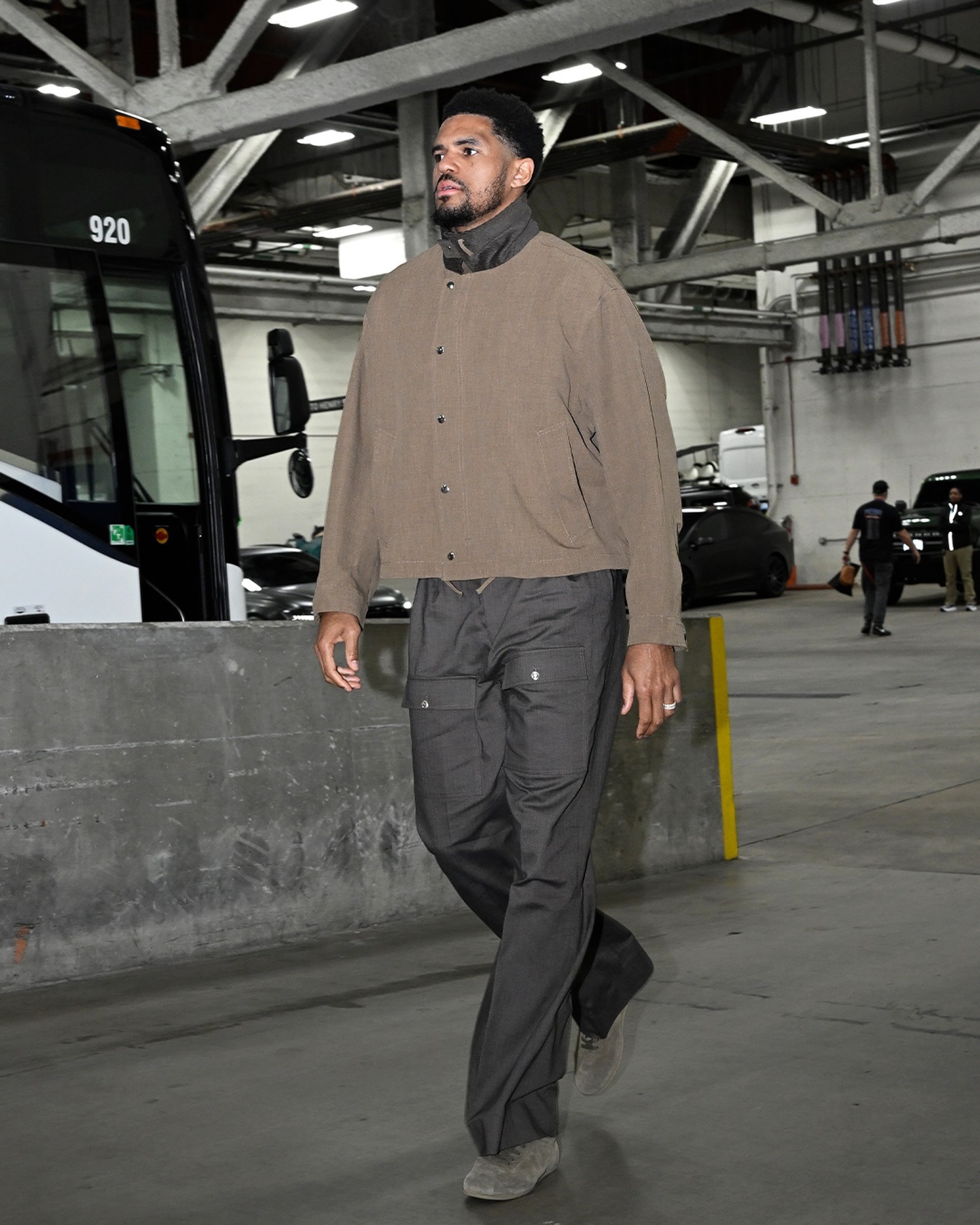 Tobias Harris wearing Acne Studios Bomber with leather collar, Versace Cotton gabardine cargo pants and Copenhagen Studios CPH121M suede off black.