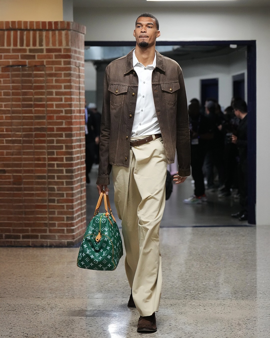Victor Wembanyama wearing Louis Vuitton Coffee Indigo Denim Long-Sleeved Shirt, MM6 Maison Margiela asymmetric trousers and Yves Saint Laurent LE LOAFER.