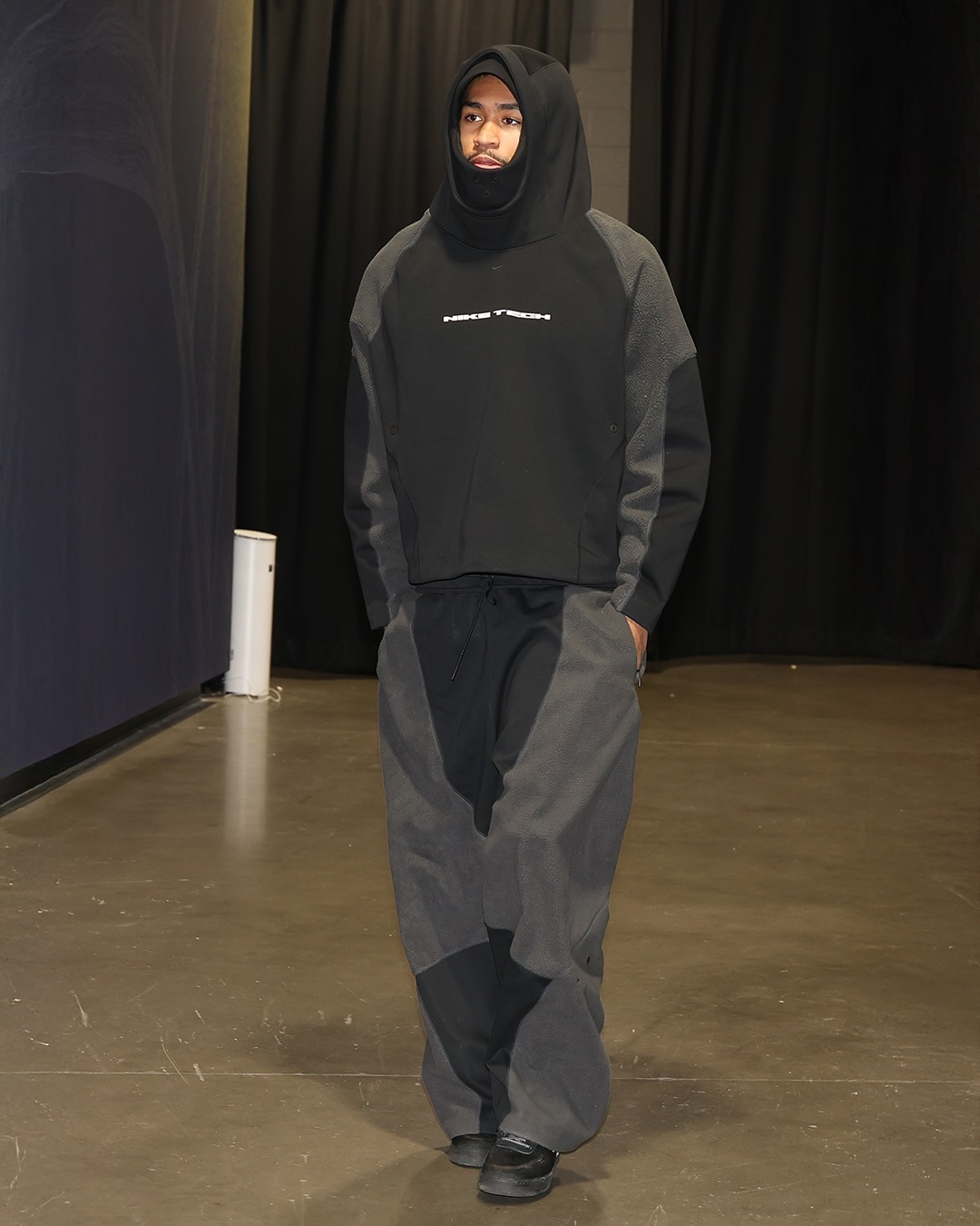 Dylan Harper wearing Nike Nike tech boreas men’s oversized hoodie, Nike Nike tech boreas men’s knit open-hem pants and Nike Nike af1 ’07 lv8.