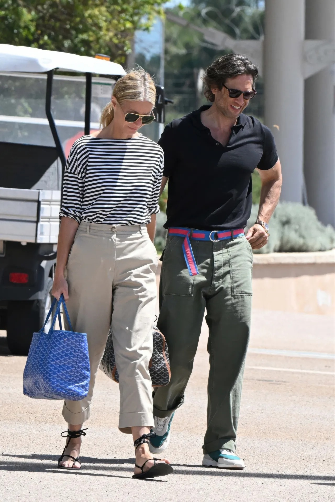 Gwyneth Paltrow wearing GWYN Marney striped t-shirt, GWYN Cyd beige pant and Goyard Saint louis reversible tote coated canvas and printed canvas pm.