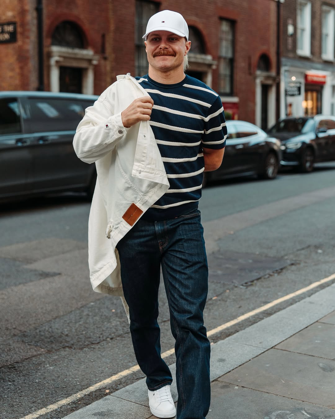 Valtteri Bottas wearing Tommy Hilfiger Garment-dyed pleated denim jacket – White, Tommy Hilfiger New york label breton stripe knit relaxed t-shirt.