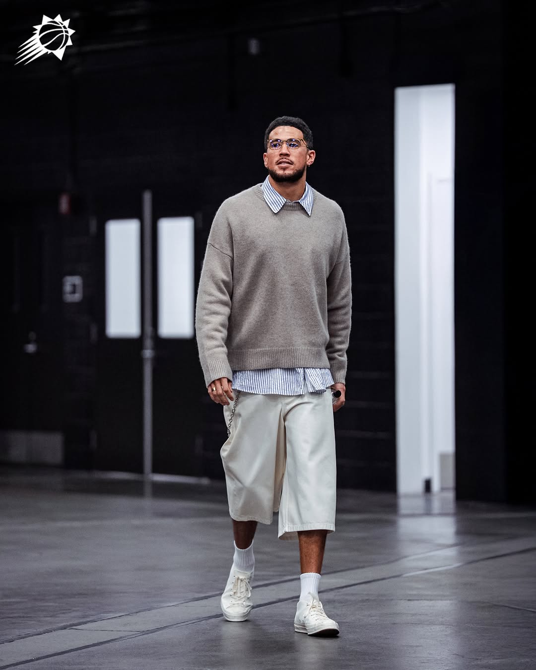Devin Booker wearing Frame Cashmere Crewneck Sweater Grey, A.P.C. Westland shorts Ecru and Converse Chuck taylor all star canvas Classic Colors White.