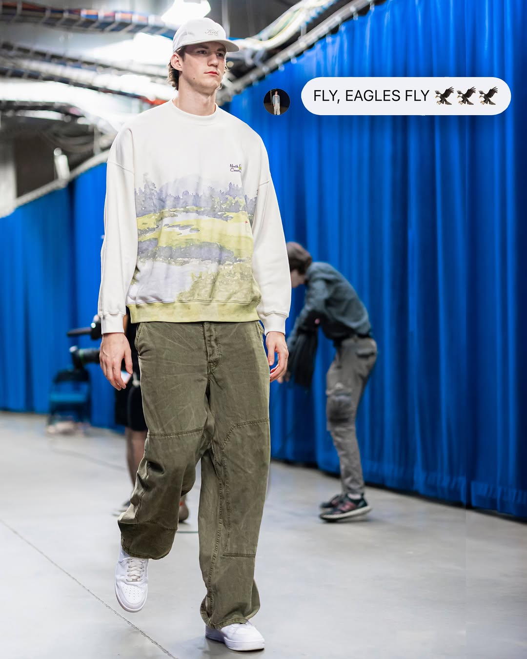 Donovan Clingan wearing Abercrombie & Fitch Abercrombie & fitch north carolina sweatshirt, Acne Studios Palma face canvas trousers khaki and Nike.