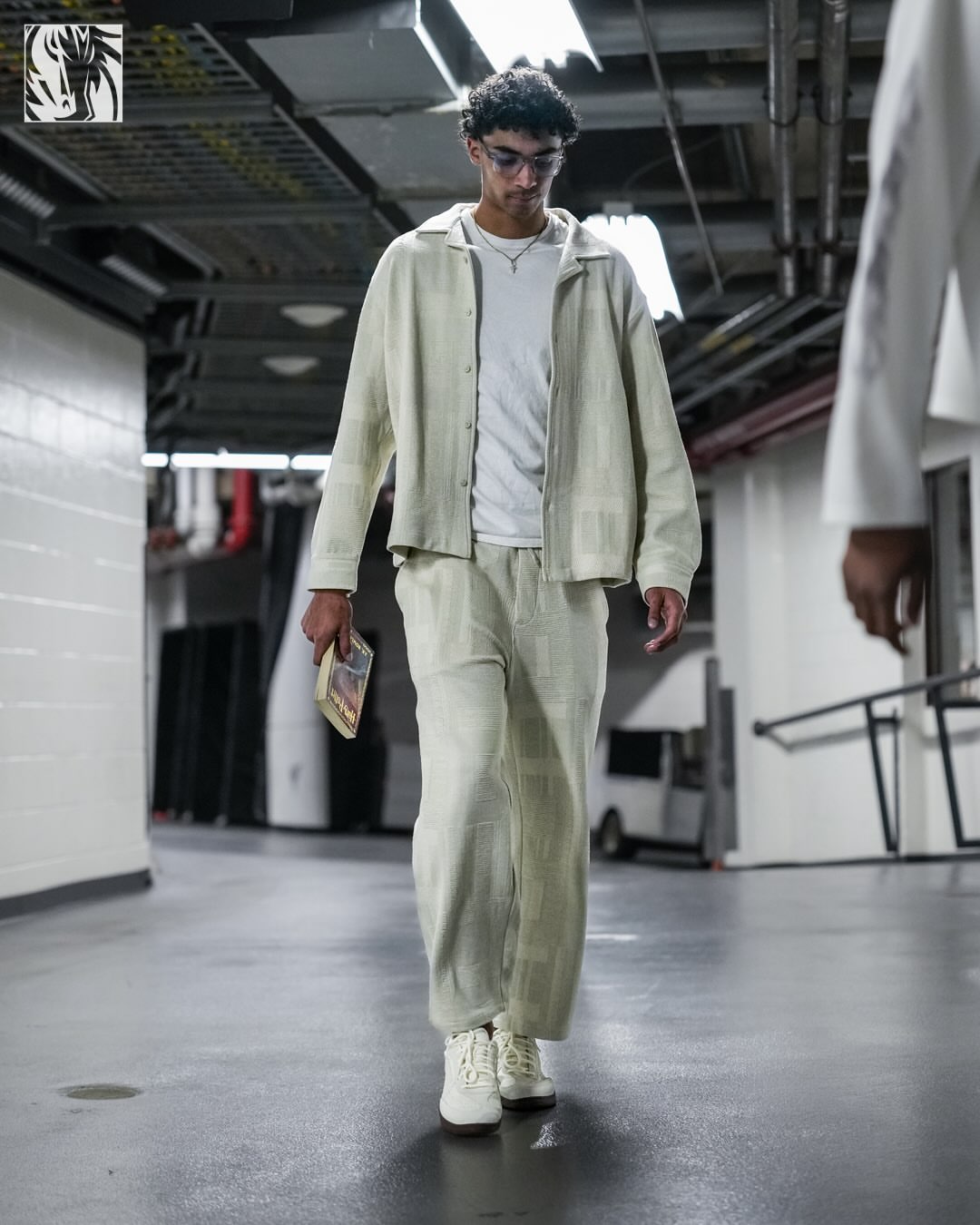 Max Christie wearing Kith Kith geometric knit cohen shirt hallow, Kith Kith geometric knit elmhurst pant hallow and Reebok Hammer street sneakers beige.