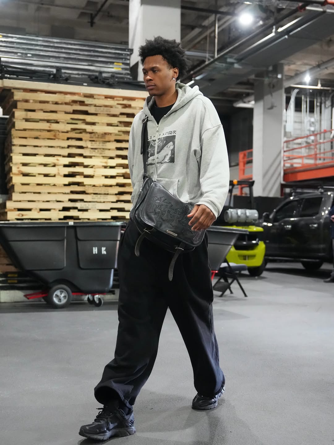 Peyton Watson wearing Enfants Riches Deprimes Assemblage Zip Hoodie ‘Heather Grey’, Chrome Hearts Cross patches Messengers black bag and Nike Nike.