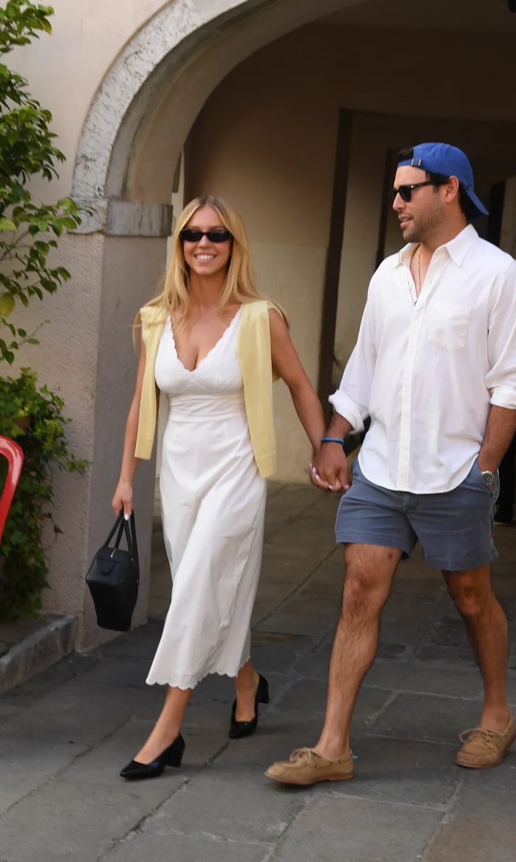 Sydney Sweeney wearing Posse Teo Ivory Sweater, Posse Lois White Dress and Clarks Fernie court black leather heels.