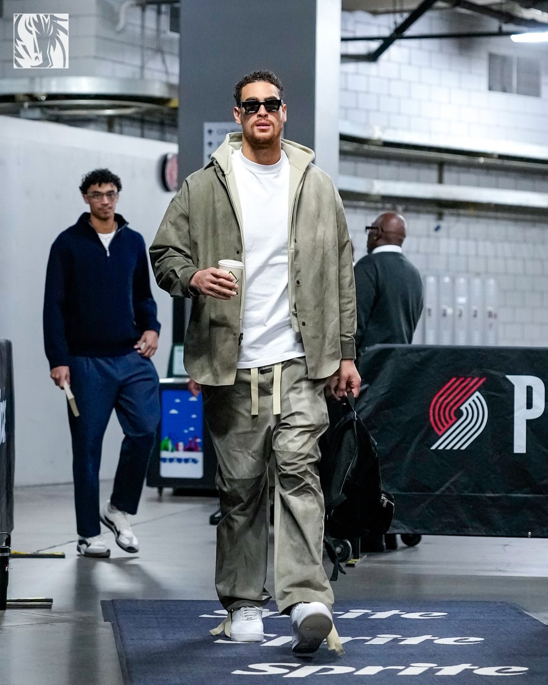 Dwight Powell wearing Fear Of God Tie-dye cotton shirt beige and kaki, Fear Of God Split knee drawstring trousers beige and kaki and Nike Nike Air Force 1.
