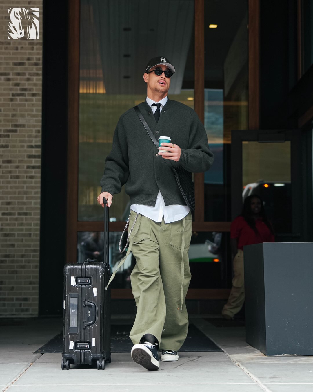 Dwight Powell wearing Jacquemus The pallone cardigan dark grey, The Frankie Shop Chard balloon pants – khaki and Converse Converse leather chuck taylor.