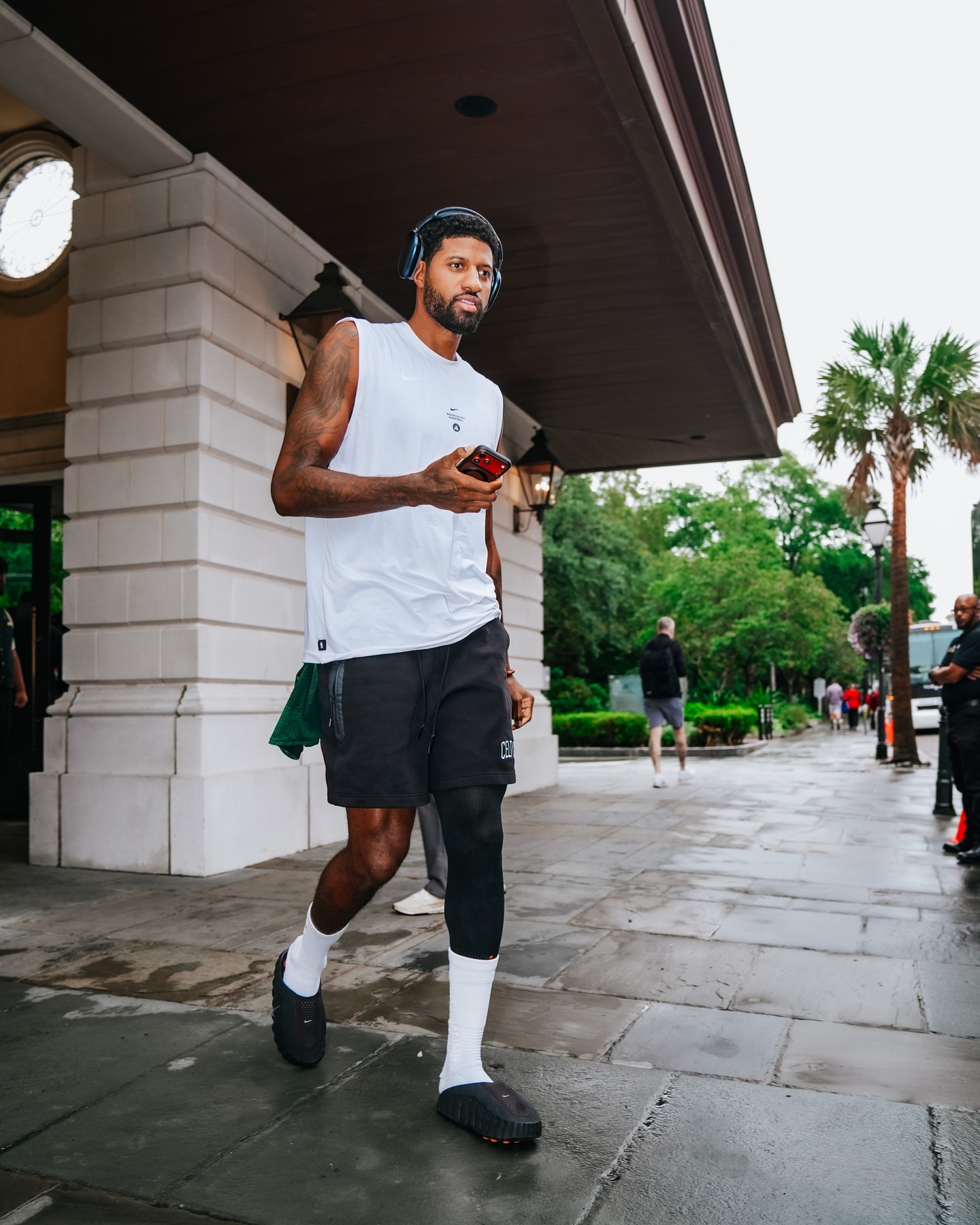Paul George wearing Nike Boston celtics nike 2026 standard issue pregame sleeveless icon tank grey, New Era Boston celtics shorts black and Nike Nike mind 001.