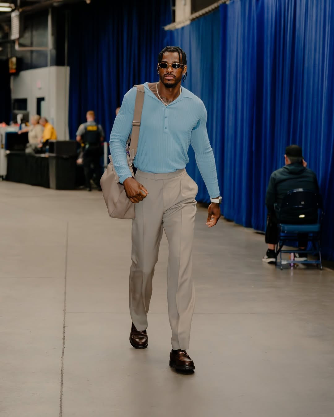 Jarred Vanderbilt wearing Saint Laurent Men’s Wool, Cashmere and Silk Ribbed Polo Sweater, Valentino Wool Gabardine Pants with Turn-ups and Marc Nolan.