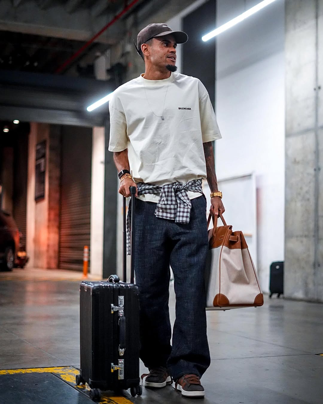 Luis Diaz wearing Balenciaga New balenciaga back medium fit t-shirt in off white, The Frankie Shop Drew denim pants – raw wash and Adidas Campus 00s.