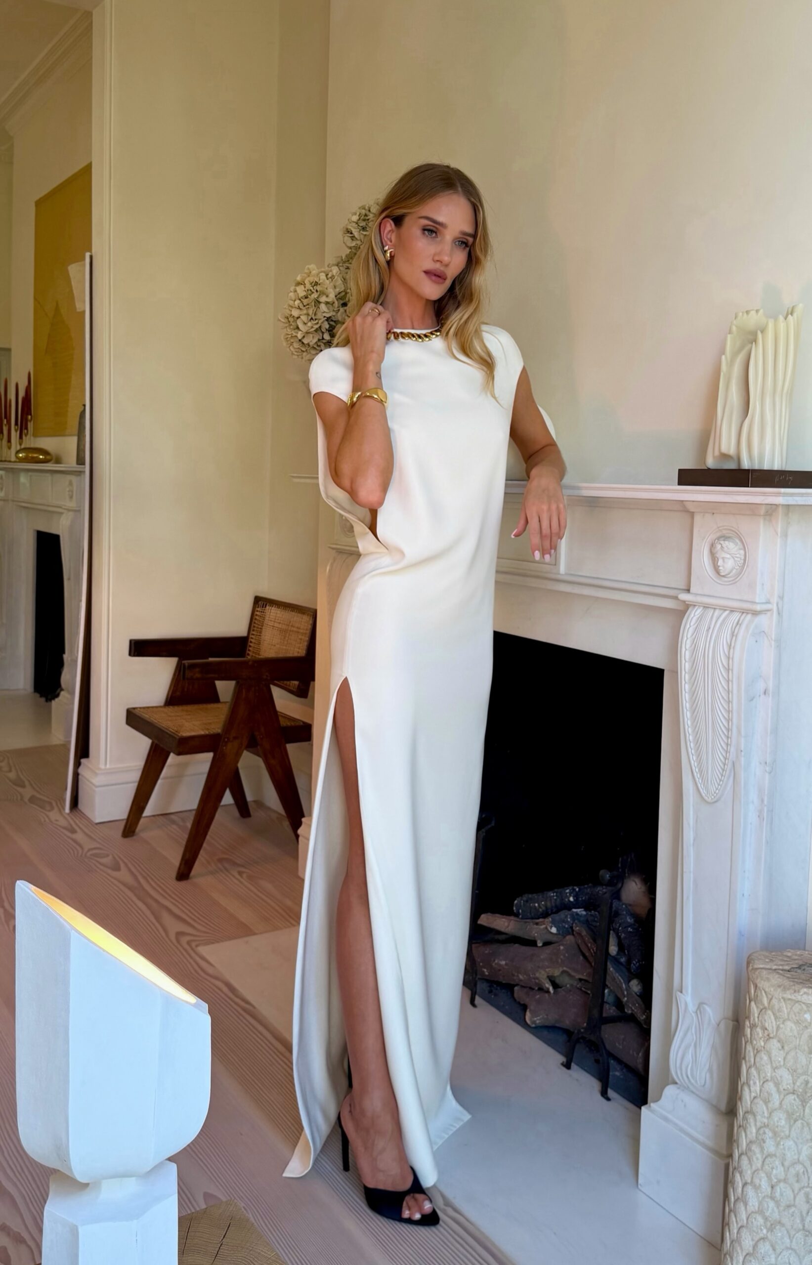 Rosie Huntington-Whiteley wearing Tom Ford Stretch-silk georgette gown – White and Victoria Beckham Satin mules black with arc heel.