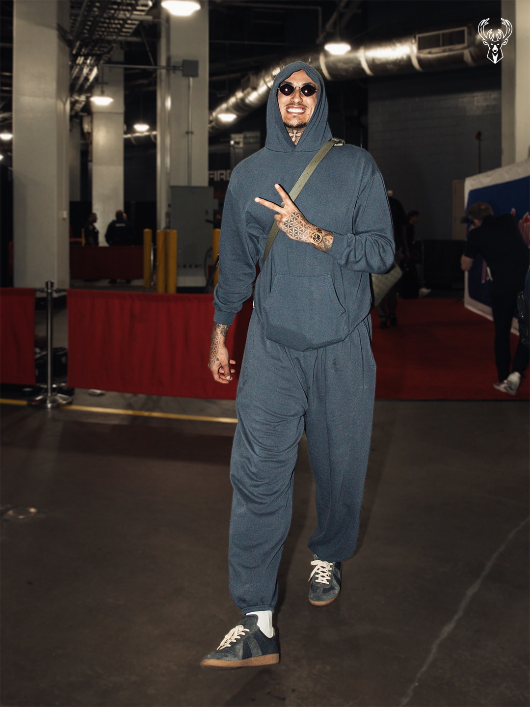 Kyle Kuzma wearing Elwood Core Zip Hoodie – Vintage grey, Elwood Core Sweatpants – Vintage grey and Maison Margiela Replica sneakers – blue.