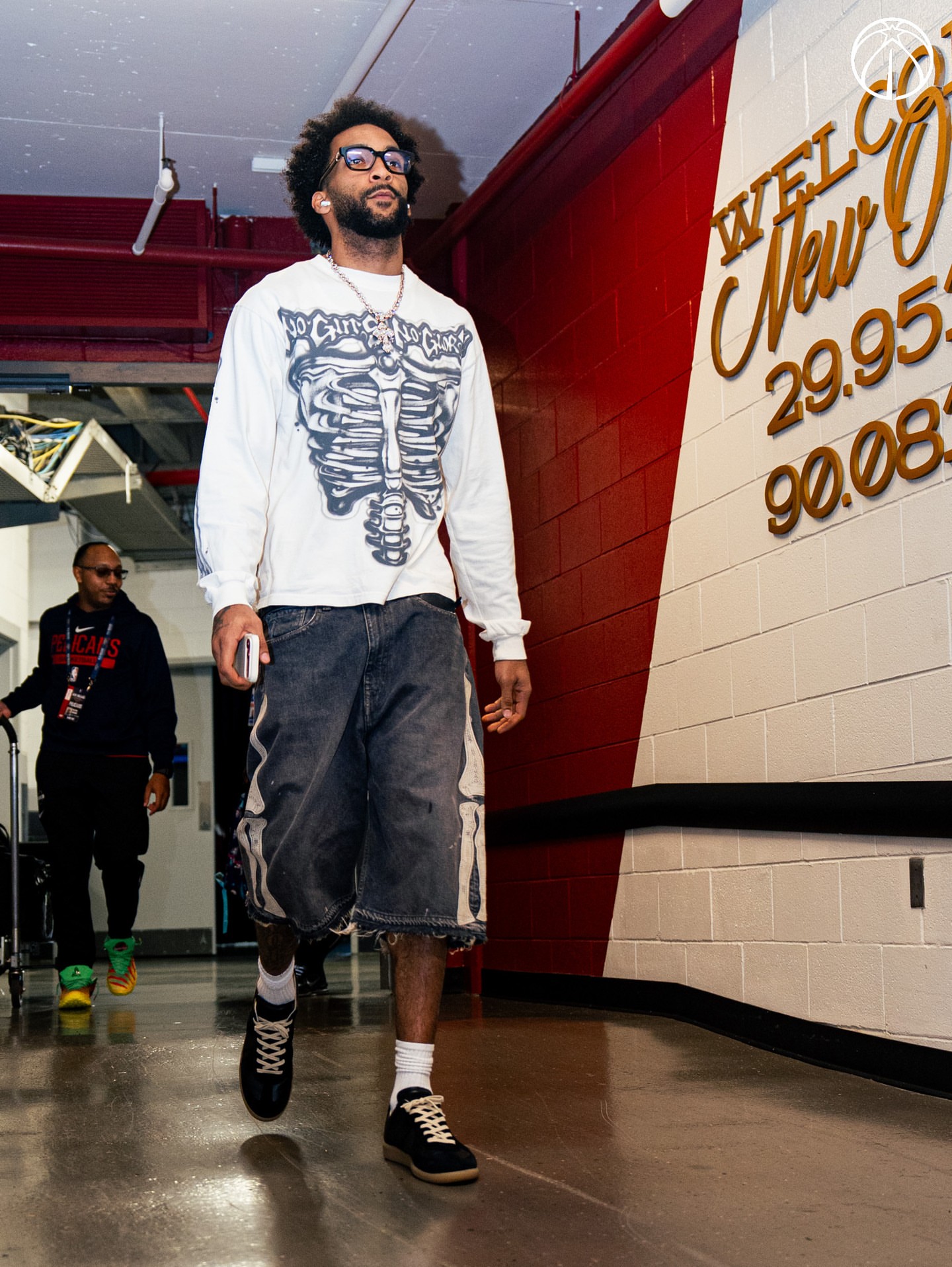 Justin Champagnie wearing Hellstar Airbrushed bones white tee, Kapital 14 oz denim 5p bone embroidery shorts black and Maison Margiela Replica sneakers black.